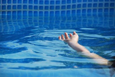 Person swimming in pool