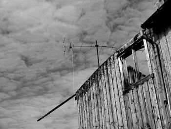 Low angle view of cables against sky