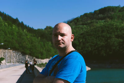 Portrait of man against tree mountain