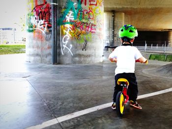 Full length of boy riding bicycle at park