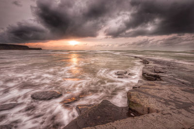 Scenic view of sea against sky during sunset