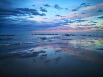 Scenic view of sea against sky at sunset