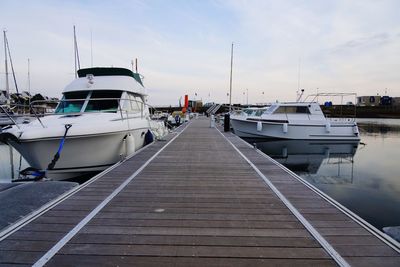 Boats moored at harbor