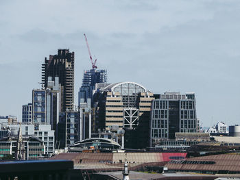 Modern buildings in city against sky