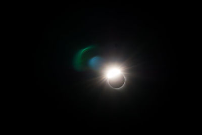 Low angle view of illuminated moon against sky