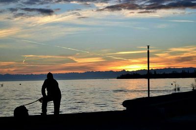 Silhouette of people at sunset