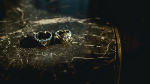 High angle view of wedding rings on table