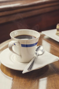 Close-up of coffee cup on table