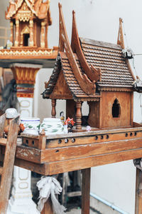 Close-up of temple on table against building