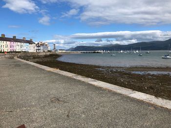 Scenic view of beach against sky in city