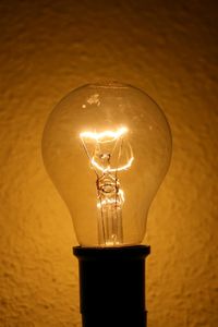 Close-up of illuminated light bulb