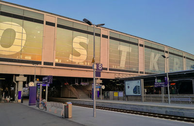 Train on railroad station platform against clear sky