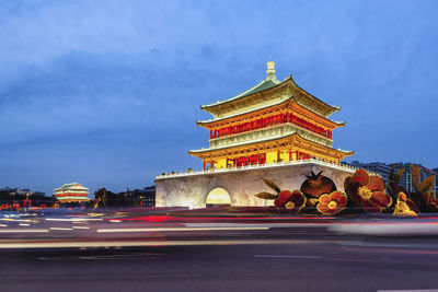 View of illuminated building against sky in city