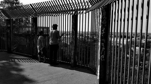 Shadow of man in cage