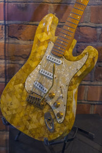 Close-up of guitar on table