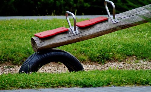 Bicycle on field against grass in park