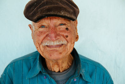 Portrait of smiling man wearing hat