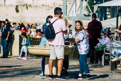 Group of people enjoying in city