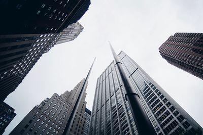 Low angle view of modern buildings against clear sky