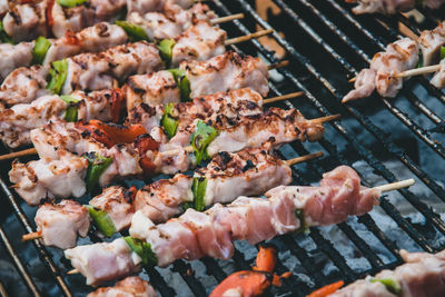 High angle view of meat on barbecue grill