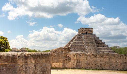 Ruins of temple against cloudy sky