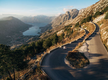 Road amidst mountains against sky