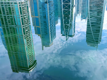 Modern skyscrapers in water reflection