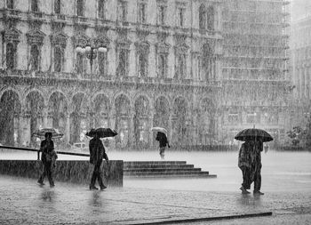 People walking in the rain