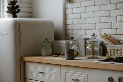 Wine bottles on shelf at home