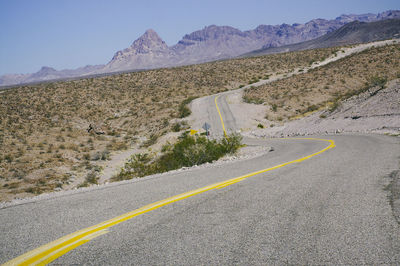 Road leading towards mountains