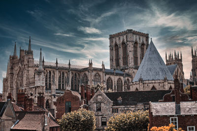Panoramic view of buildings in city against sky