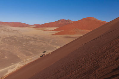 Scenic view of desert against clear sky