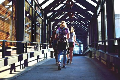 Woman running on footbridge