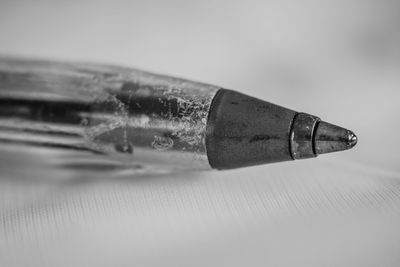 Close-up of ballpoint pen on table