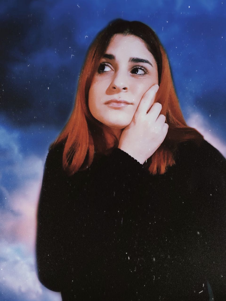 PORTRAIT OF BEAUTIFUL YOUNG WOMAN STANDING AGAINST SKY