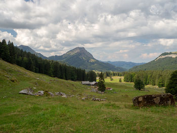 Scenic view of landscape and mountains against sky