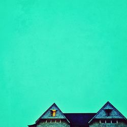 Low angle view of buildings against blue sky