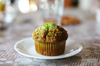 Close-up of muffin served in plate on table