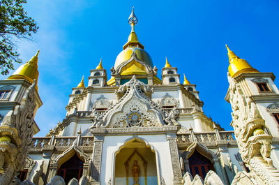 Low angle view of temple against blue sky