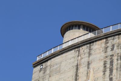 Low angle view of building against blue sky