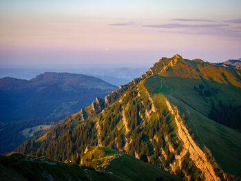 Panoramic view of mountains against sky during sunset