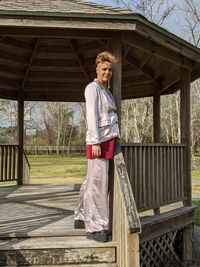 Portrait of woman standing in built structure