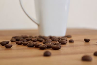 Close-up of coffee beans on table