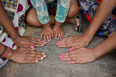 High angle view of women hands