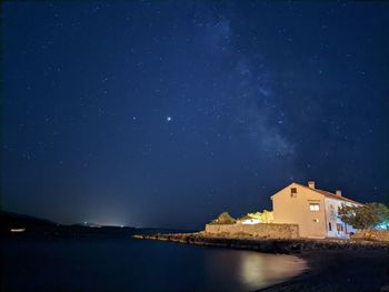 Scenic view of sea against sky at night