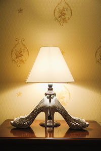 Close-up of lamp on table at home