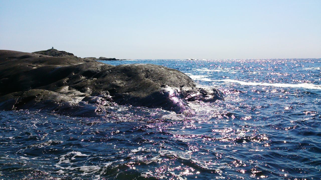 sea, water, clear sky, beauty in nature, horizon over water, scenics, tranquility, tranquil scene, nature, copy space, rock - object, blue, beach, rock formation, idyllic, shore, outdoors, rock, day, sky