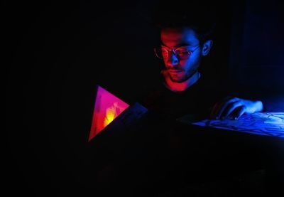 Portrait of man in darkroom