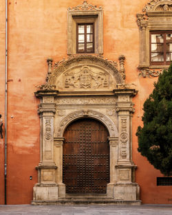 Beautiful old wooden door in granada, andalusia, spain