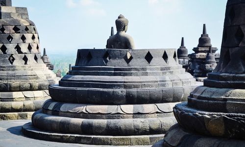 View of temple against building